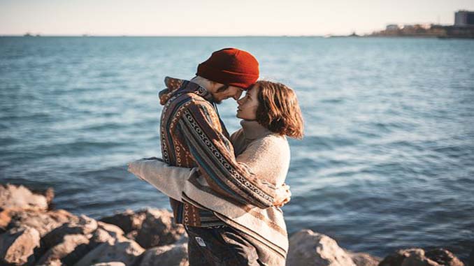Couple Hugging At The Lake