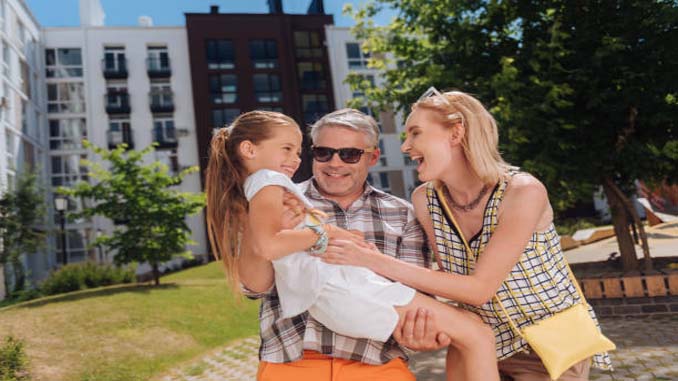 Mature Man With His Younger Wife And Child