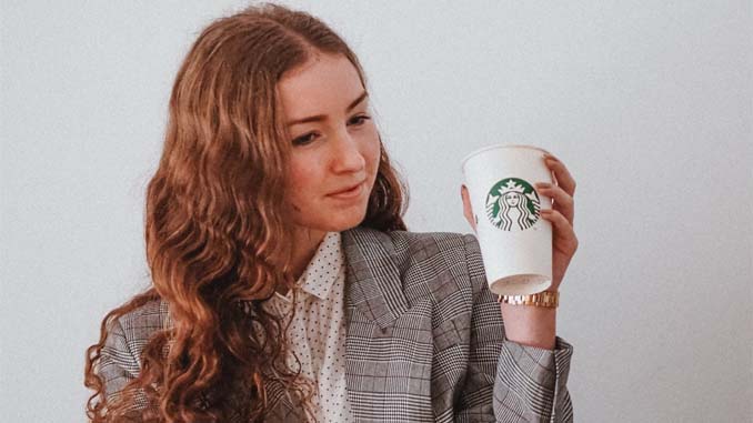Woman With A Coffee In Her Hand