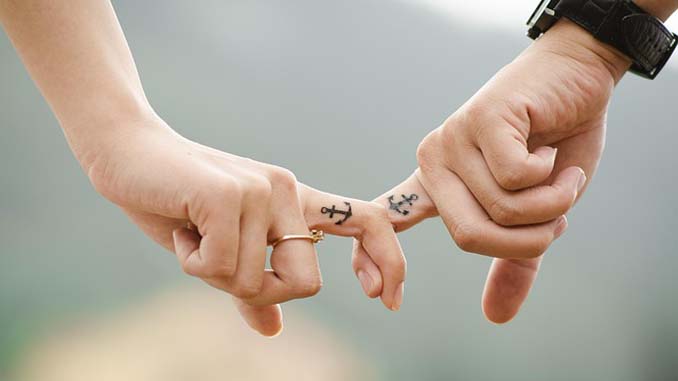 Couples With Matching Anchors Tattooed On Their Index Fingers