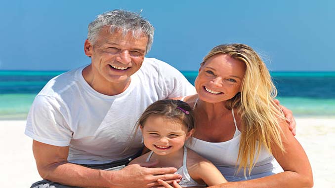 Older Man With Younger Woman And A Child