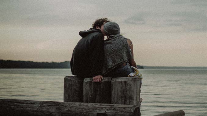 Couple Kissing On The Pier