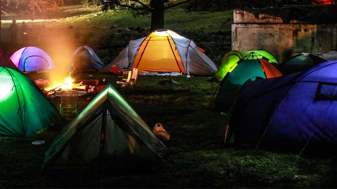 Dozens Of Tents At A Campground At Night