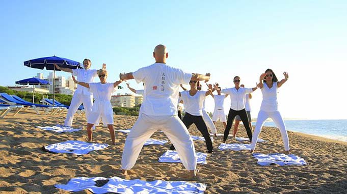 A Class Performing Yoga