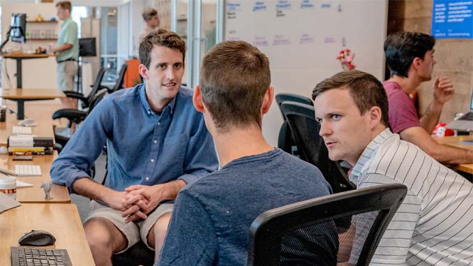 Three Men Having A Discussion