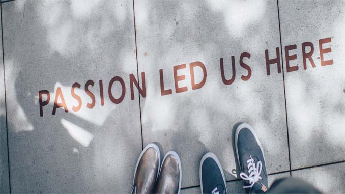 "Passion Led Us Here" Painted On The Sidewalk