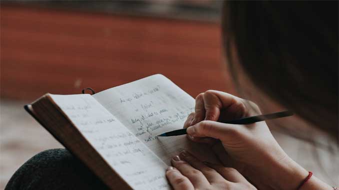 Woman Writing In Her Journal