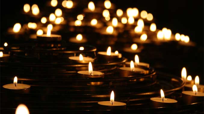 Dozens Of Lit Candles