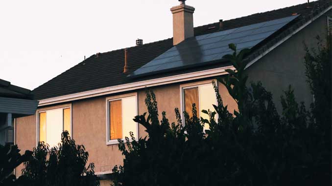 House With Solar Panels On The Roof