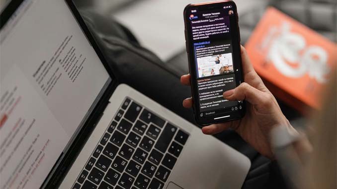 Woman Working On Her Laptop And Cellphone