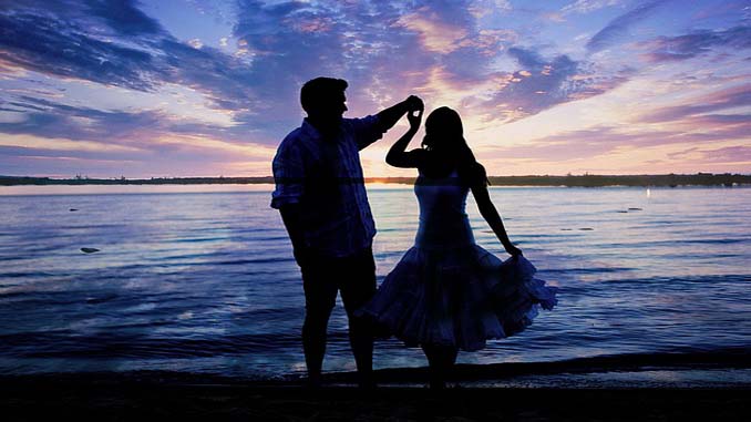 Couple Dancing On The Beach