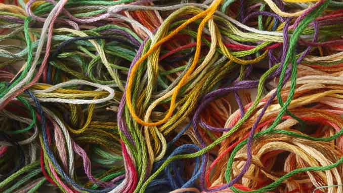 Various Strands Of Thread In A Variety Of Colors