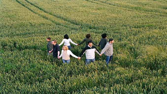 8 People Holding Hands In A Crop Circle