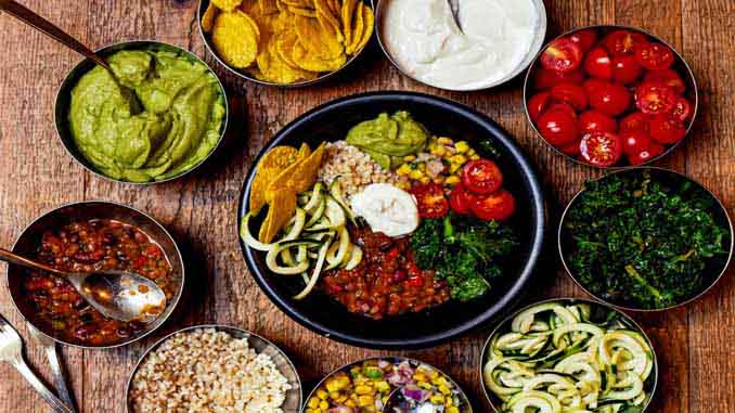 Bowls With Avocado Dip, Sour Cream, Beans, Tomatoes...
