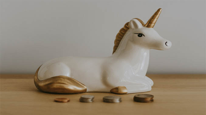 Porcelain Unicorn With Coins In Front Of It
