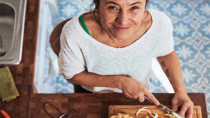 Older Woman Chopping Veggies