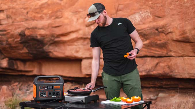 Man Cooking Outdoors Using Solar Energy