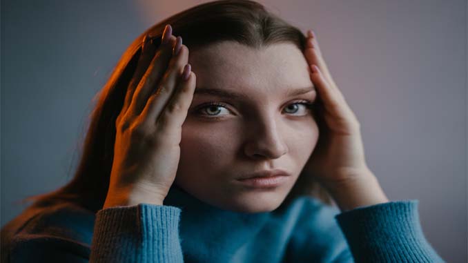 Woman With Her Head In Her Hands