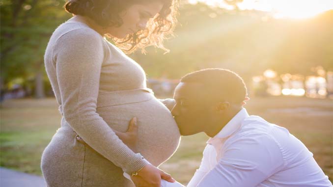 Man Kissing Pregnant Wife's Belly