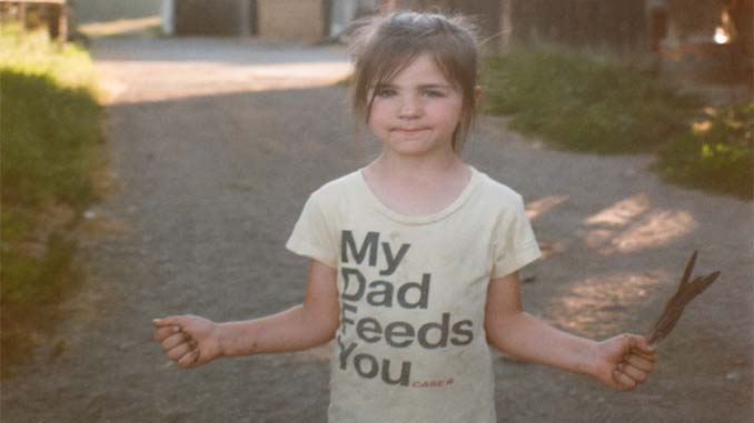 Young Girl Wearing T-Shirt "My Dad Feeds You..."