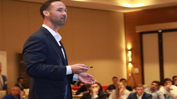 Man Speaking To A Group Of People