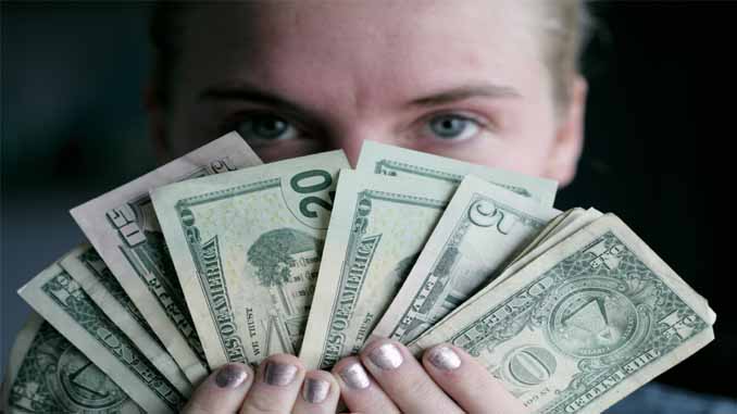A Woman Holding Cash