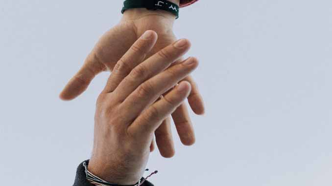 Hand Helping Another Up