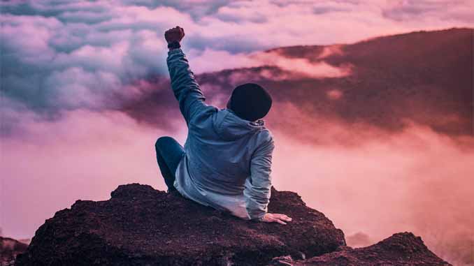Man On A Mountain Top Fist Pumping