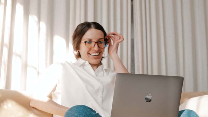 Happy Woman At Her Laptop