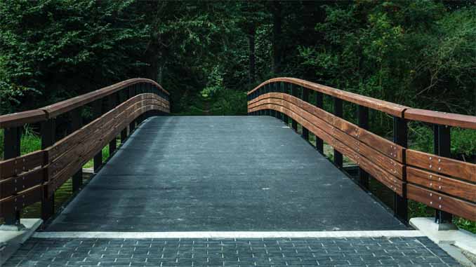 A Bridge Leading Into The Forest