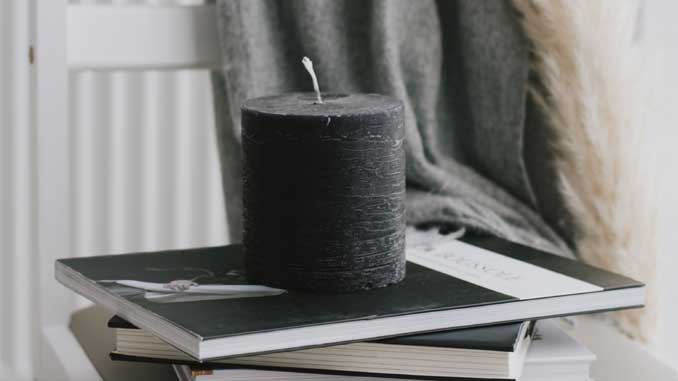 A Candle On Top Of Books