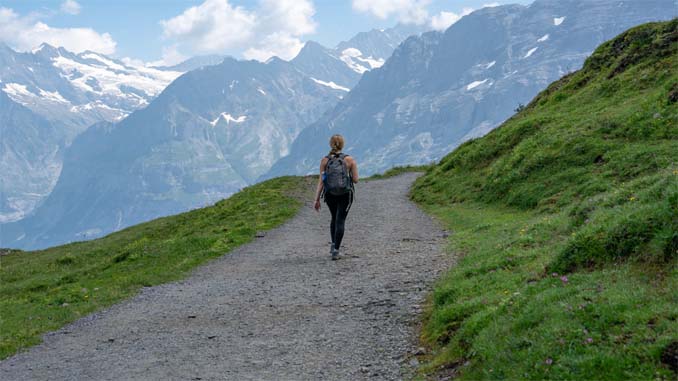 Woman Walking On A Path