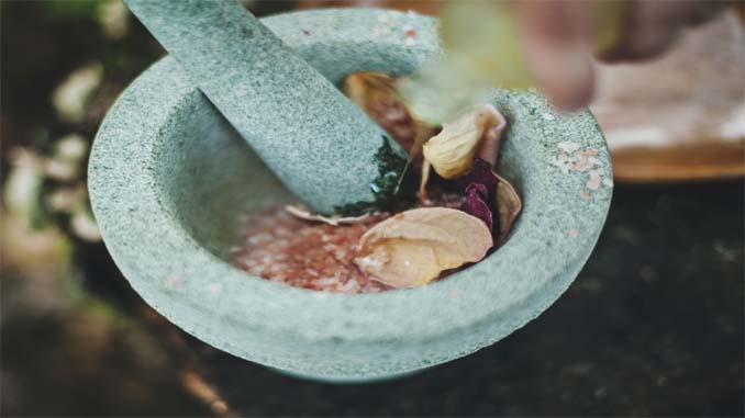Herbs Being Crushed In A Bowl