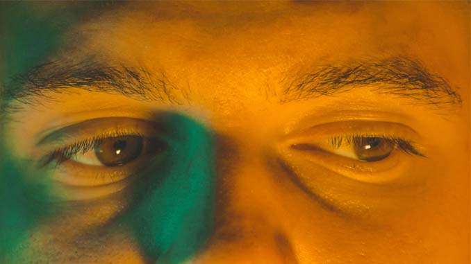 Man With His Eyes Looking Down And To The Left