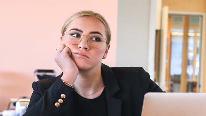 Woman Daydreaming At Work