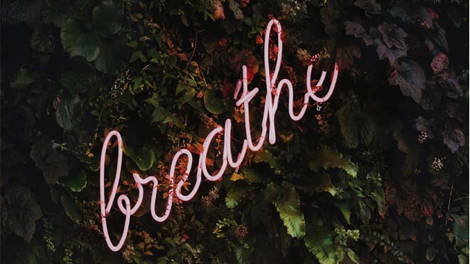 Neon Word Saying "Breathe"