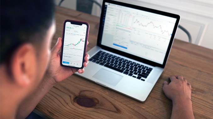 Man On Laptop And Cellphone