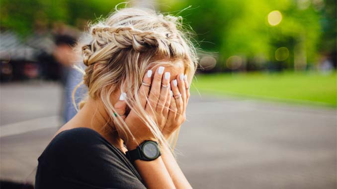 A Woman With Her Head In Her Hands