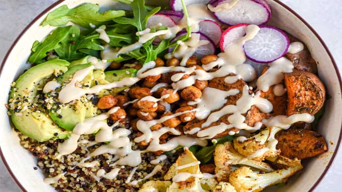 A Plate With Avocado, Chick Peas, Quinoa And Other Veggies