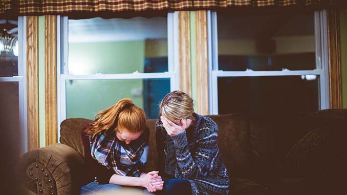 Two Women Comforting Each Other