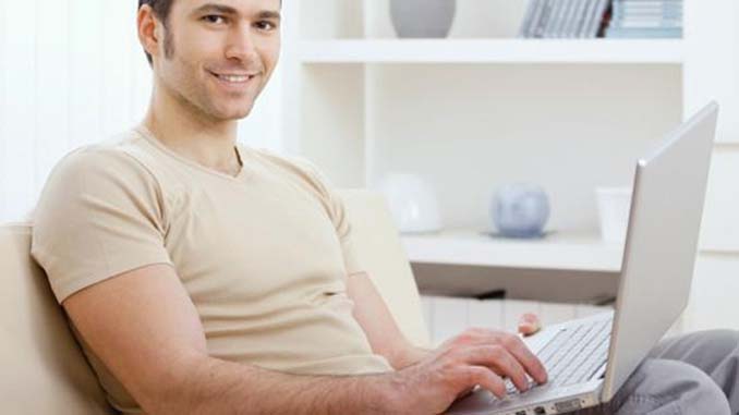 Man On Couch With Laptop
