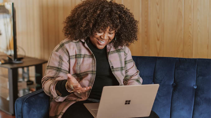 Happy Woman At Her Laptop