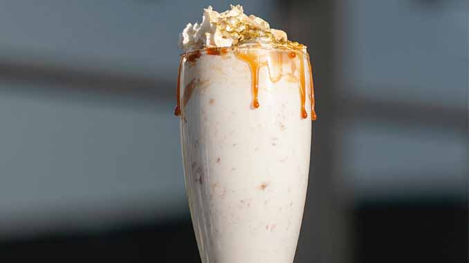 Tall Smoothie With Cream On Top And Caramel Dripping Down The Glass