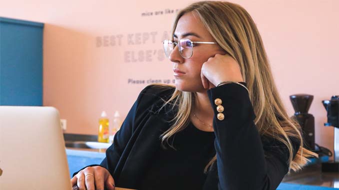 Woman Daydreaming At Work