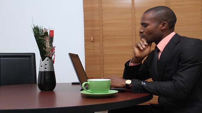 Young Man At His Laptop
