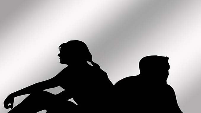 Silhouette Of Man And Woman Back To Back
