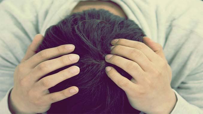 Man With His Head In His Hands