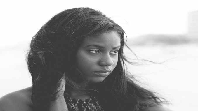 A Young Woman Looking Off Into The Distance