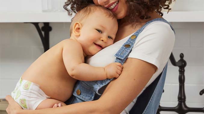 Mother Holding Her Smiling Baby