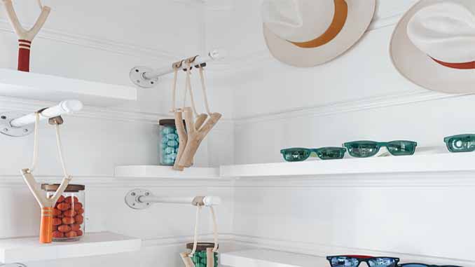 Various Items Arranged On Shelves In A Closet